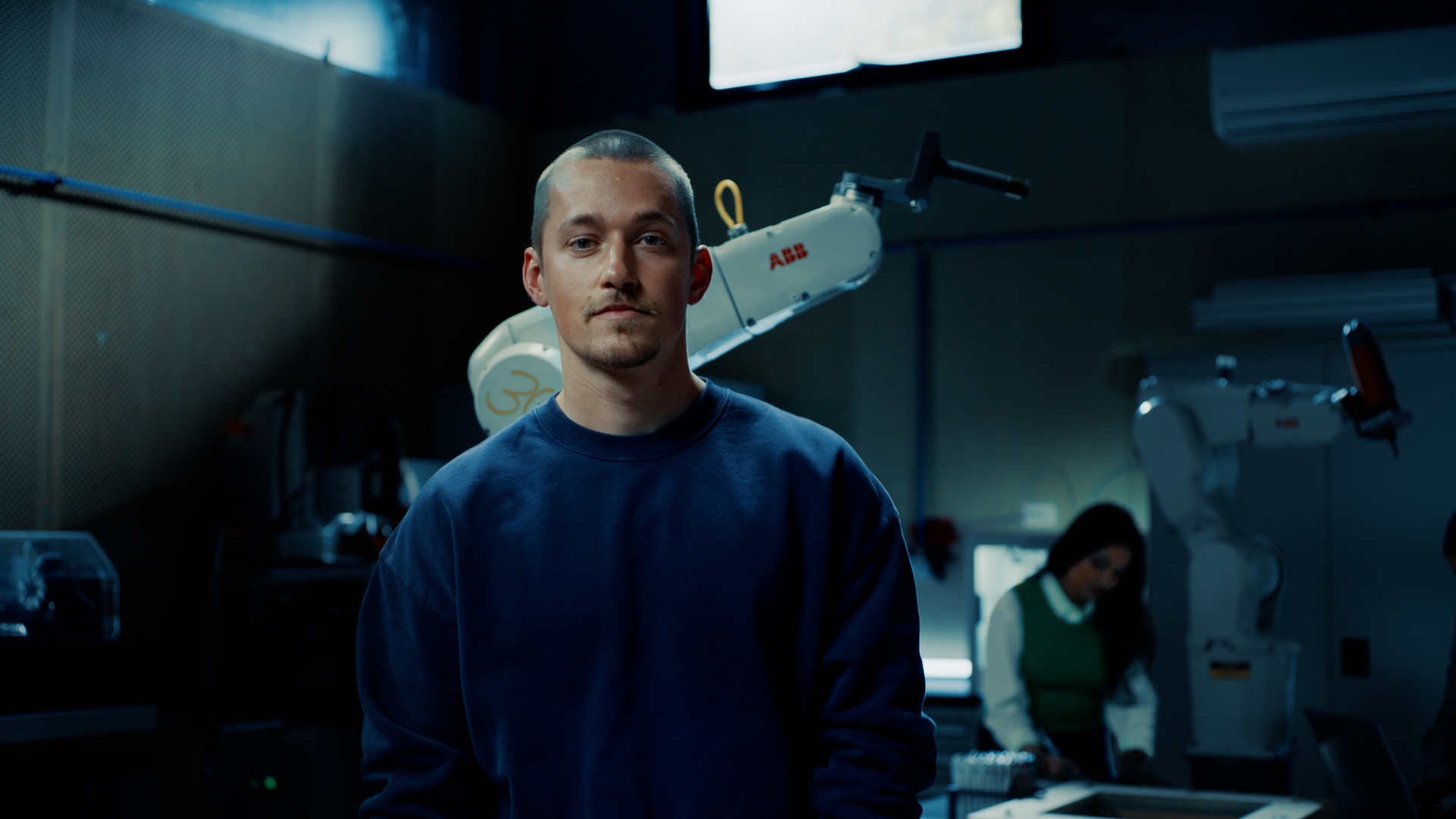 Student standing in lab facing camera