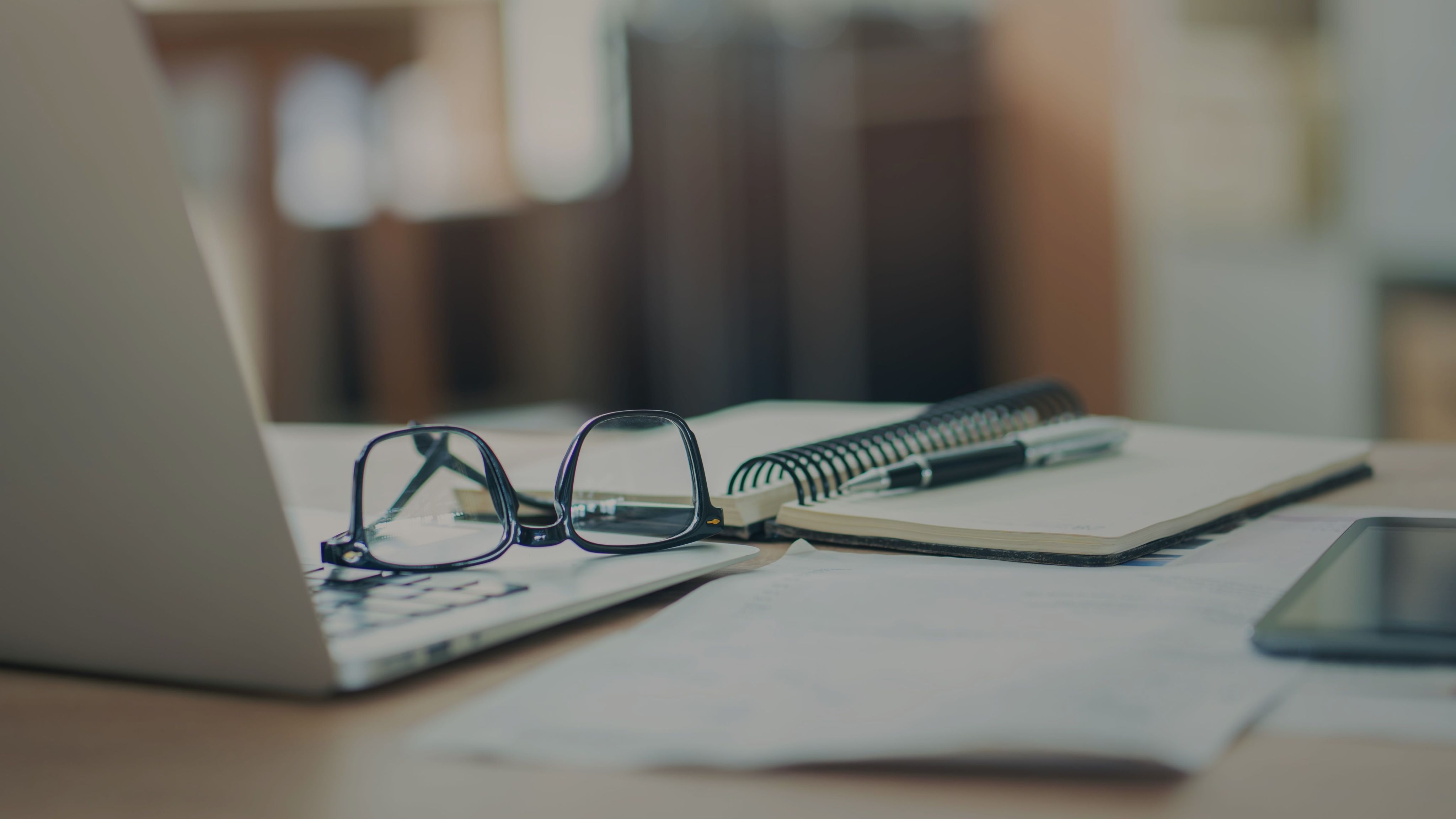 Woman using a smartphone on a yoga mat.