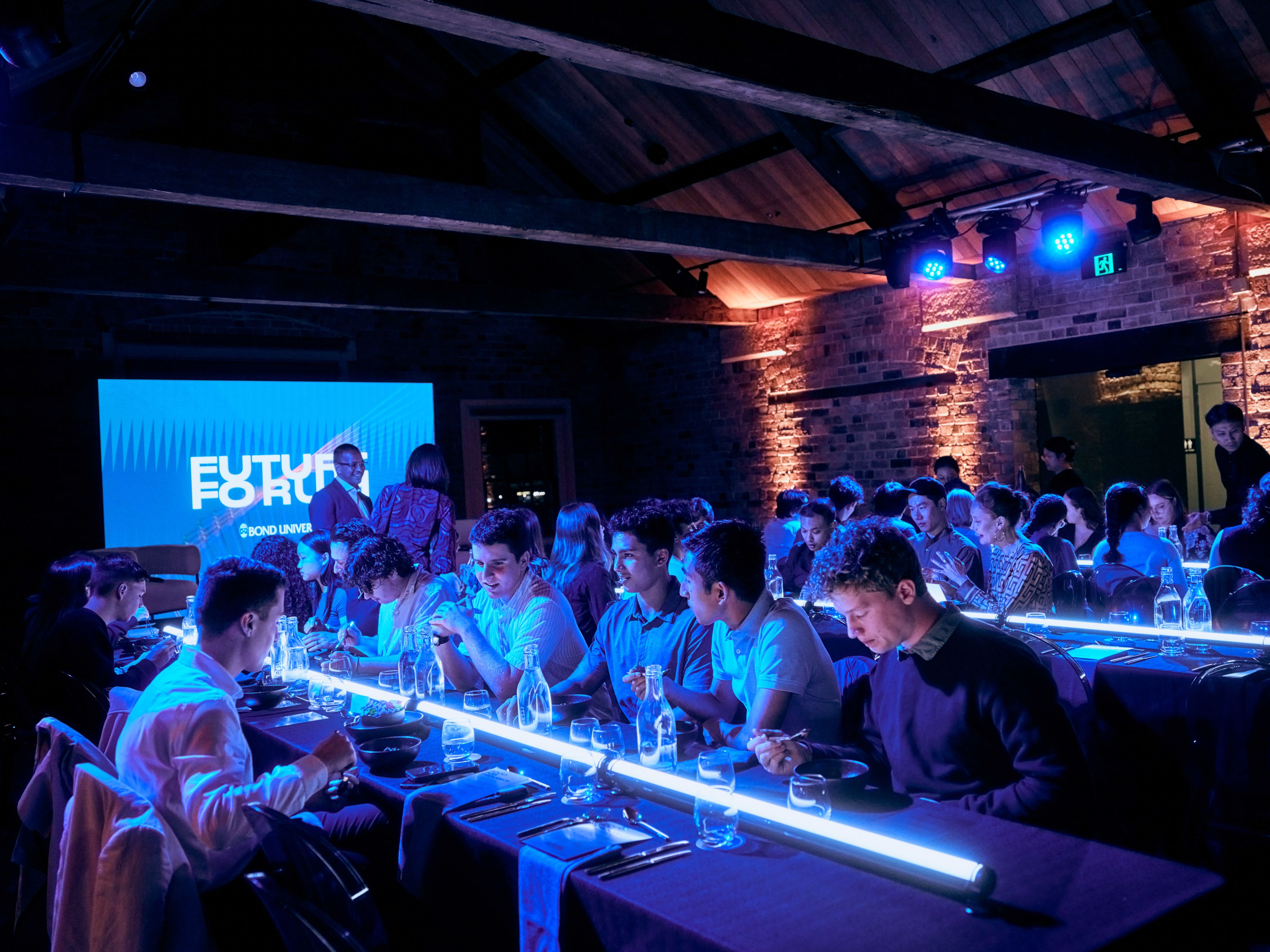 People sat around long tables.