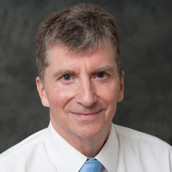 A man in a shirt and tie