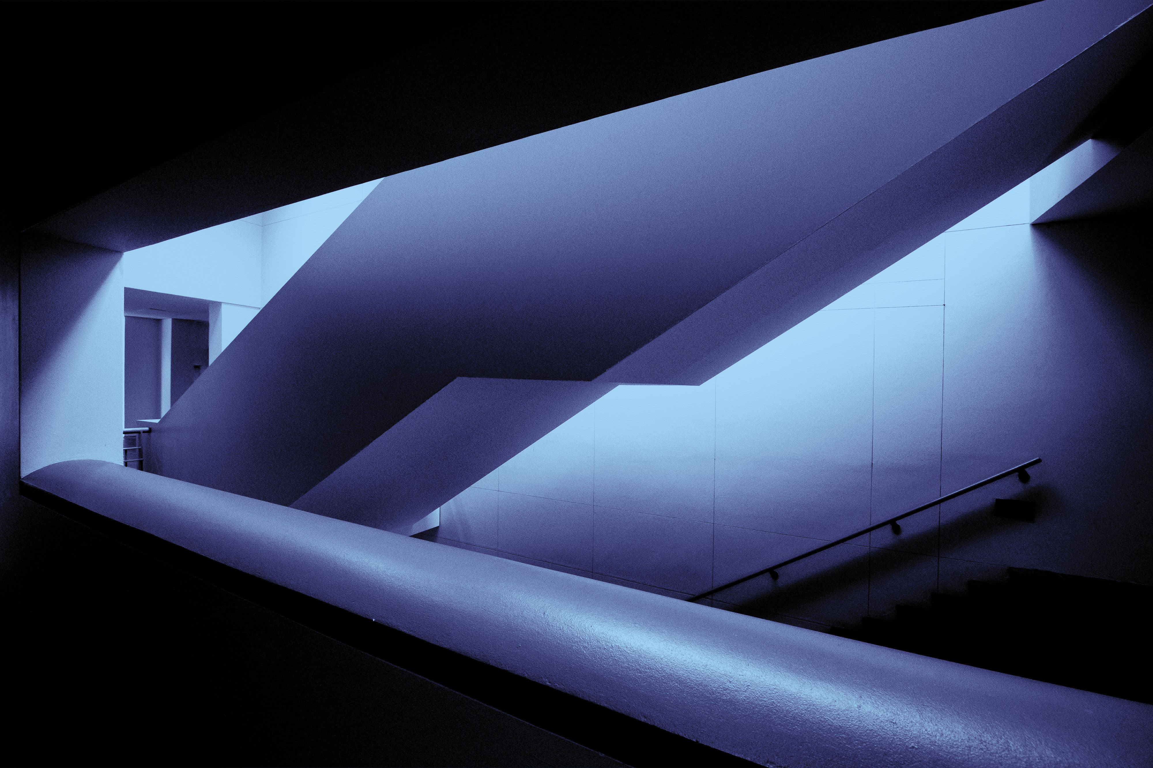 Dramatic sunset obscured by dark clouds and mist