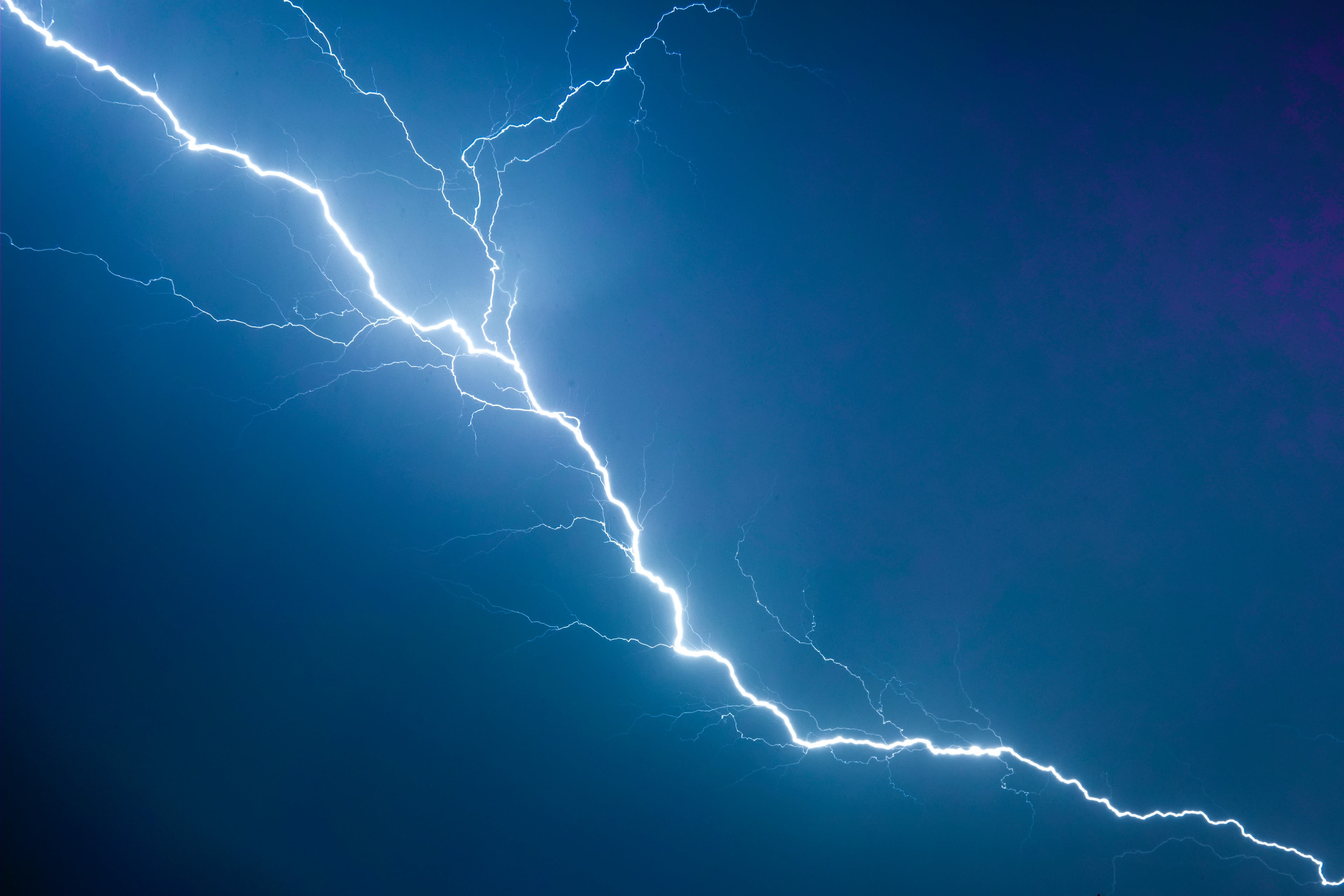 a lightning bolt is seen in the sky