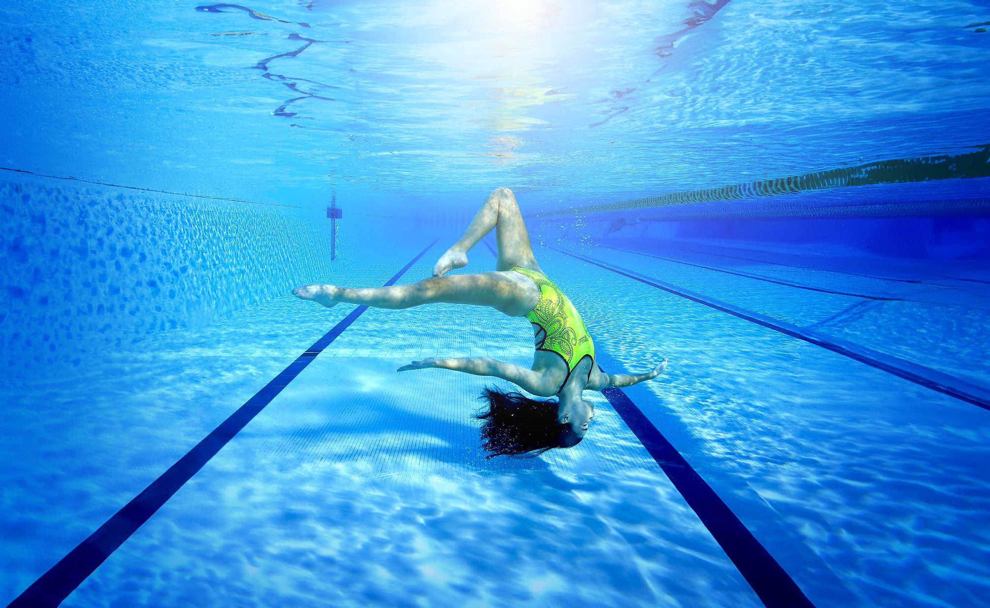 a blue pool with clear blue water