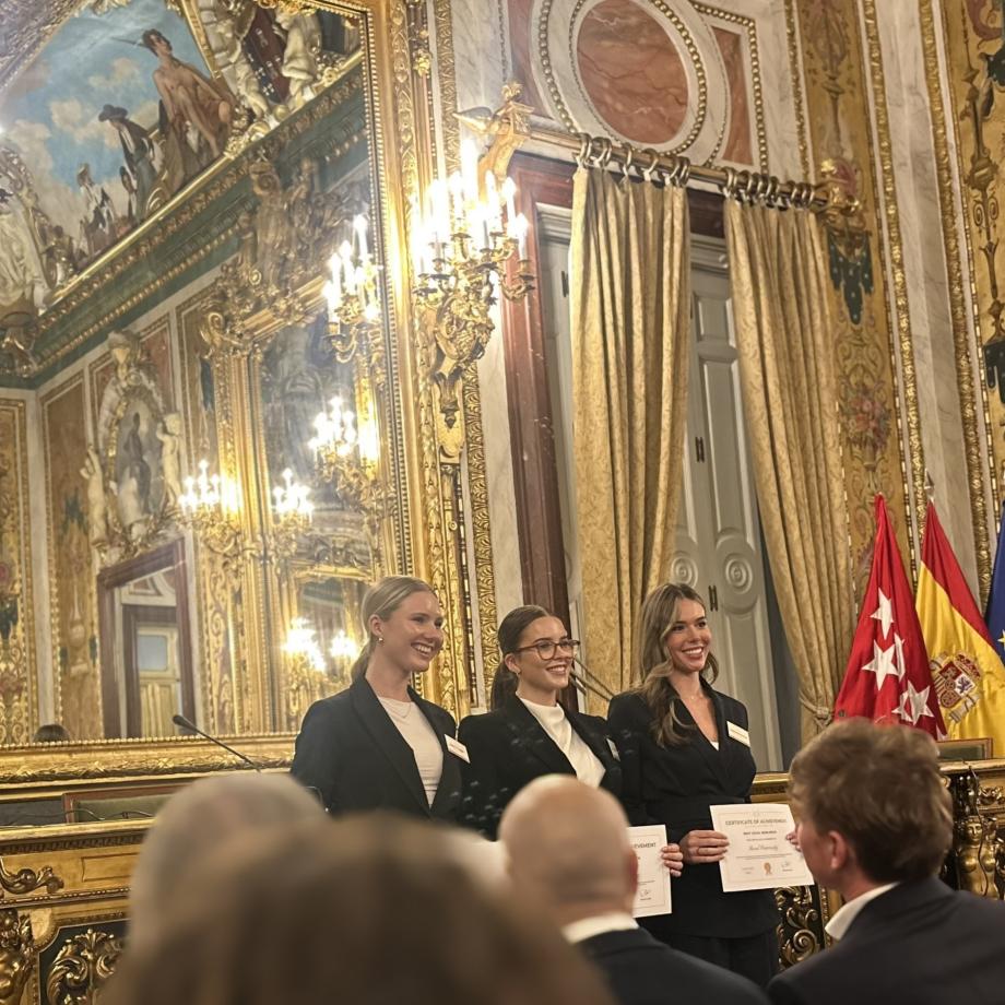 three students in a palace
