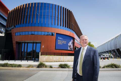Vice Chancellor and President Tim Brailsford in front of the new building 
