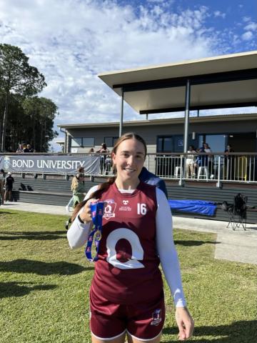 Arianna Clarke with her Best on Ground medal