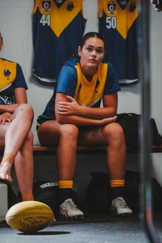 Maisy Evans listening to coach Andy Lovell pregame