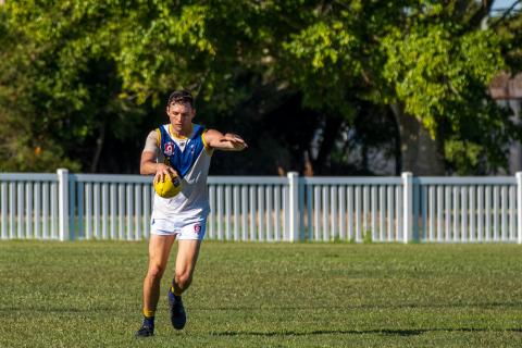 Will King kicking the footy