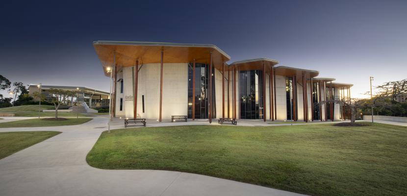 Abedian School of Architecture building at night with surrounding lights turned on.