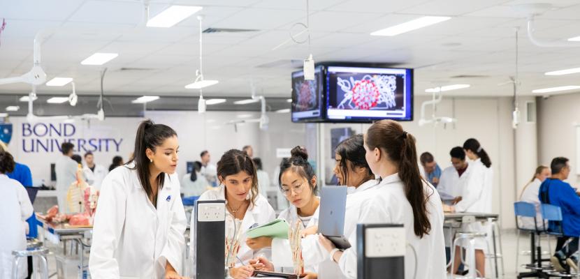 A group of people inside the Health Sciences & Medicine anatomy laboratory.