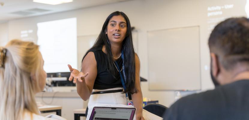 Meera Klemola is speaking to two Bond University students in a classroom