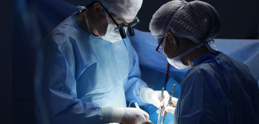 Two surgeons operate on a patient