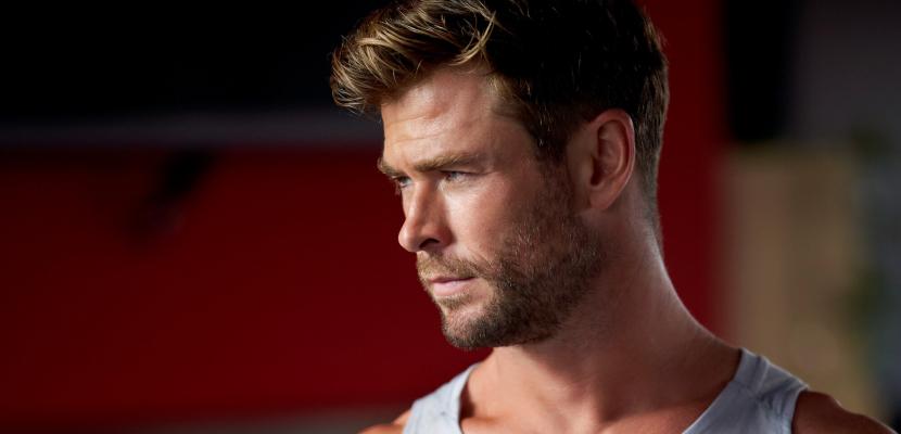 A close up of Chris Hemsworth looking to one side