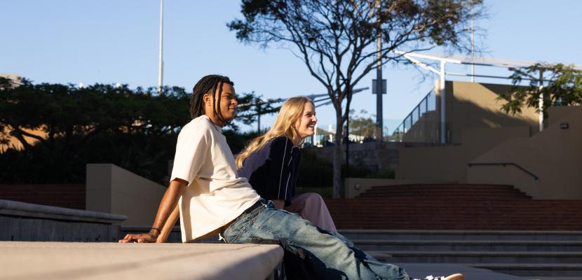 Students sitting looking off in the distance