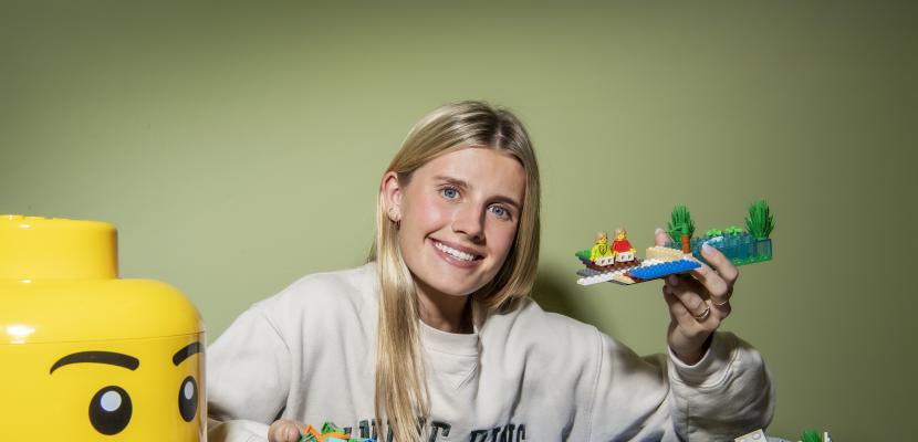 Communications student Bianca Licina said holding up a Lego model for a photo.