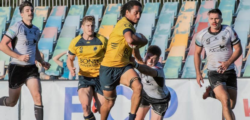  Nixon Taramai brushes off a tackle on the rugby field