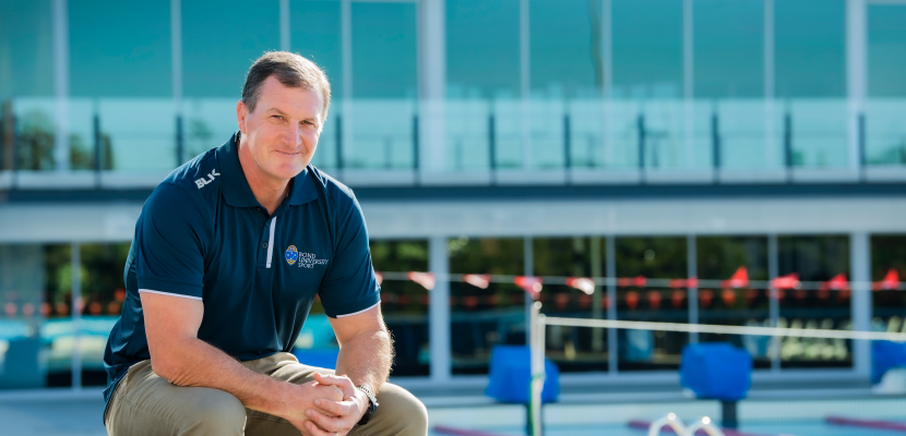 Director of Sport Michael Collins sitting near Bond Swimming pool