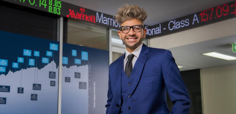 Bond Uni Student Milind Tiwari posing for camera in the Bond Business School classroom