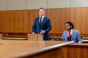 Male Law students mooting in Bond's Moot Court