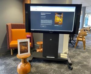 Screen in Law Library foyer displaying an ebook