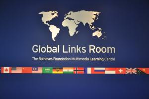 Map of the world above text "Global Links Room" and a row of international flags